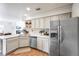 Bright kitchen featuring stainless steel appliances, light countertops, and seamless transition to living areas at 20000 Mitchell Pl # 9, Denver, CO 80249