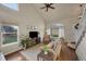 Bright living room with hardwood floors, vaulted ceilings, large windows, and neutral color palette at 20000 Mitchell Pl # 9, Denver, CO 80249