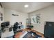 Functional home office featuring a desk, ergonomic chair, and a window providing natural light for productivity at 20000 Mitchell Pl # 9, Denver, CO 80249