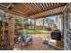 Cozy patio area with a pergola, comfortable seating, and a barbecue grill at 20000 Mitchell Pl # 9, Denver, CO 80249