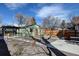 Spacious backyard featuring a detached garage, pergola, and a mix of patio and gravel areas for entertaining at 4403 Alcott St, Denver, CO 80211