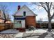 Brick house with a picnic table in the backyard, complemented by a stone pathway and mature trees at 4403 Alcott St, Denver, CO 80211