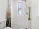 Shower with white subway tile, black and white tile floor, and rainfall shower head at 4403 Alcott St, Denver, CO 80211