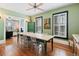 This dining room features a rustic table, hardwood floors, and stylish decor at 4403 Alcott St, Denver, CO 80211