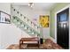 Welcoming foyer features stylish tile flooring, a staircase, and unique decor at 4403 Alcott St, Denver, CO 80211