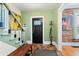 Welcoming foyer features stylish flooring, a staircase, and unique decor at 4403 Alcott St, Denver, CO 80211