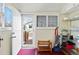 Mud room featuring storage shelves, a back door, a bench, and wood shutters at 4403 Alcott St, Denver, CO 80211