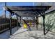 Backyard pergola with string lights, offering an inviting outdoor space with seating at 4403 Alcott St, Denver, CO 80211