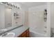 Bright bathroom with tile surround, updated fixtures, and plenty of counter space at 9024 Gale Blvd # 3, Thornton, CO 80260