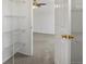 Bedroom with a ceiling fan and organized walk-in closet at 9024 Gale Blvd # 3, Thornton, CO 80260