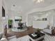 Bright living room featuring a fireplace, dining area, and seamless flow into the kitchen at 9024 Gale Blvd # 3, Thornton, CO 80260