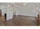 Open living room with hardwood flooring, fireplace, and modern lighting at 9024 Gale Blvd # 3, Thornton, CO 80260
