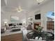 Inviting living room with a fireplace, dining area, and plenty of natural light at 9024 Gale Blvd # 3, Thornton, CO 80260