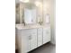 Bright bathroom featuring double sink vanity with white cabinets and modern fixtures at 2110 Decatur St, Denver, CO 80211