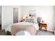 Comfortable bedroom features soft textures, and coordinated decor at 2110 Decatur St, Denver, CO 80211