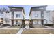 Modern townhome showcasing a contemporary design with a walkway and landscaping at 2110 Decatur St, Denver, CO 80211