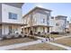 Beautiful modern townhomes feature a contemporary design with gray and white exterior paint at 2110 Decatur St, Denver, CO 80211