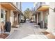 View of side door entrances of condos with adjacent exterior storage areas at 2110 Decatur St, Denver, CO 80211