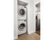 Convenient laundry area with stacked washer and dryer units at 2110 Decatur St, Denver, CO 80211