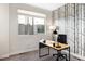 Bright office with tree-themed wallpaper, desk, and large window at 2110 Decatur St, Denver, CO 80211