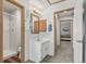 View of bathroom and bedroom featuring neutral colors, a sink, a shower, and modern fixtures at 10715 Foxwood Ct, Parker, CO 80138