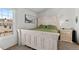 Bright bedroom featuring a queen-size bed and white distressed furniture, with ample natural light at 10715 Foxwood Ct, Parker, CO 80138