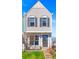 Charming two-story home featuring scalloped siding, decorative gable, and a well-manicured front lawn at 10715 Foxwood Ct, Parker, CO 80138