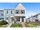 Charming townhome featuring a scalloped facade, lush lawn and inviting entryway with well-maintained landscaping at 10715 Foxwood Ct, Parker, CO 80138