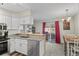 Bright kitchen opens to the dining area and features stainless steel appliances and ample counter space at 10715 Foxwood Ct, Parker, CO 80138