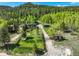 Idyllic homes nestled in a lush forest setting with scenic mountain views at 63 Sillasen Ln, Golden, CO 80403