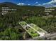 Gorgeous aerial view showing the property's boundaries, multiple cabins, and proximity to the highway at 63 Sillasen Ln, Golden, CO 80403
