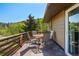Inviting outdoor deck with wood railings and table seating for four at 63 Sillasen Ln, Golden, CO 80403