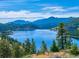 Scenic view of Gross Reservoir framed by evergreen trees, offering a tranquil and picturesque panorama at 63 Sillasen Ln, Golden, CO 80403