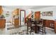 Cozy living room featuring a dining table and convenient access to the kitchen and bathroom at 63 Sillasen Ln, Golden, CO 80403