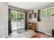 Bright living room featuring sliding glass doors with outside view and wood-look floors at 63 Sillasen Ln, Golden, CO 80403