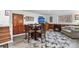 Comfortable living room with a dining table, entertainment center, and a cozy fireplace for a great ambiance at 63 Sillasen Ln, Golden, CO 80403