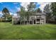 Expansive backyard showcasing the home's deck and ample green space, ideal for outdoor entertaining and relaxation at 16301 E Ida Ave, Centennial, CO 80015