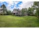 Lush backyard showcasing the home's multi-level decks and ample green space, ideal for outdoor entertaining and Gathering activities at 16301 E Ida Ave, Centennial, CO 80015