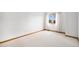 Bright, spacious bedroom with neutral walls, plush carpeting, and a sunlit window at 16301 E Ida Ave, Centennial, CO 80015