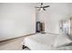 Generous bedroom featuring high ceilings, a ceiling fan, and convenient access to a walk-in closet at 16301 E Ida Ave, Centennial, CO 80015