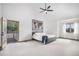 Spacious bedroom with a vaulted ceiling, ceiling fan, and access to an outdoor deck at 16301 E Ida Ave, Centennial, CO 80015