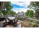 Inviting deck with an outdoor dining set and garden, perfect for al fresco meals and relaxing outdoors at 16301 E Ida Ave, Centennial, CO 80015