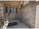 Beautifully designed front door features sidelights and a decorative wreath doormat at 16301 E Ida Ave, Centennial, CO 80015