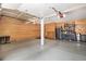 Well-lit garage with organized storage, work area, and epoxy flooring for easy maintenance at 16301 E Ida Ave, Centennial, CO 80015