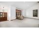 Bright living room with vaulted ceiling, large windows, and plush carpeting at 16301 E Ida Ave, Centennial, CO 80015
