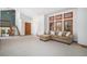 Bright living room with vaulted ceiling, staircase, and plush carpeting at 16301 E Ida Ave, Centennial, CO 80015