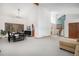 Bright, open living space with high ceilings, large windows, and modern decor at 16301 E Ida Ave, Centennial, CO 80015