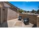 Charming front patio featuring comfortable seating and a garden wall, perfect for relaxing and enjoying the neighborhood at 16301 E Ida Ave, Centennial, CO 80015