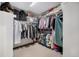 Organized walk-in closet with ample hanging space and shelving for efficient storage solutions at 16301 E Ida Ave, Centennial, CO 80015