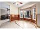 Charming dining nook with large windows and decorative trim, with view to living room at 1015 S Fulton Ave, Fort Lupton, CO 80621